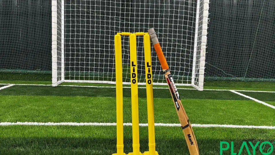 Cricket equipment on KhelVista box cricket turf